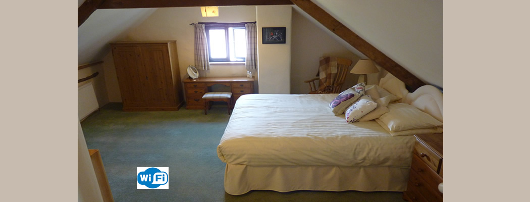 The main bedroom is enormous and can easily accommodate two extra single beds.